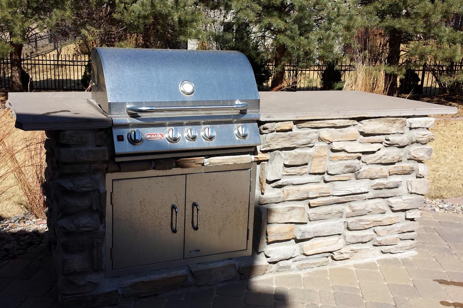 Outdoor grill with stone