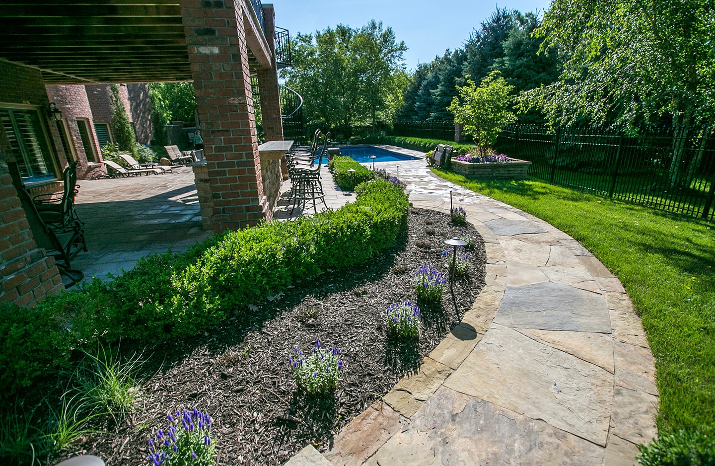 stone slab pathway leading to back yard patio