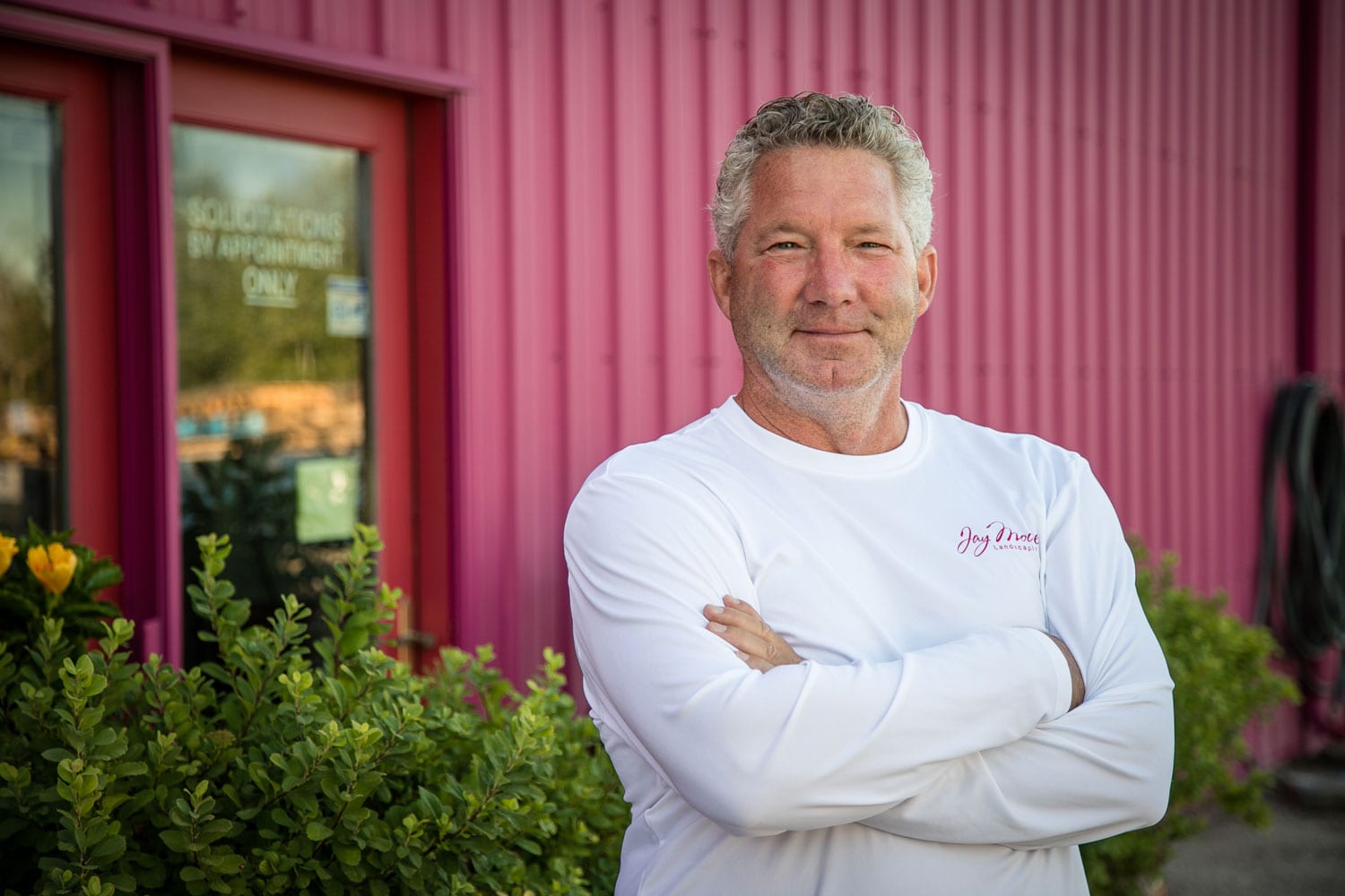 Jay Moore in front of building